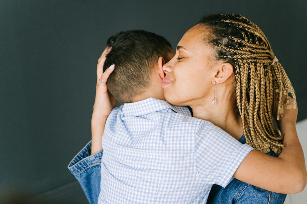 Woman cuddling a child