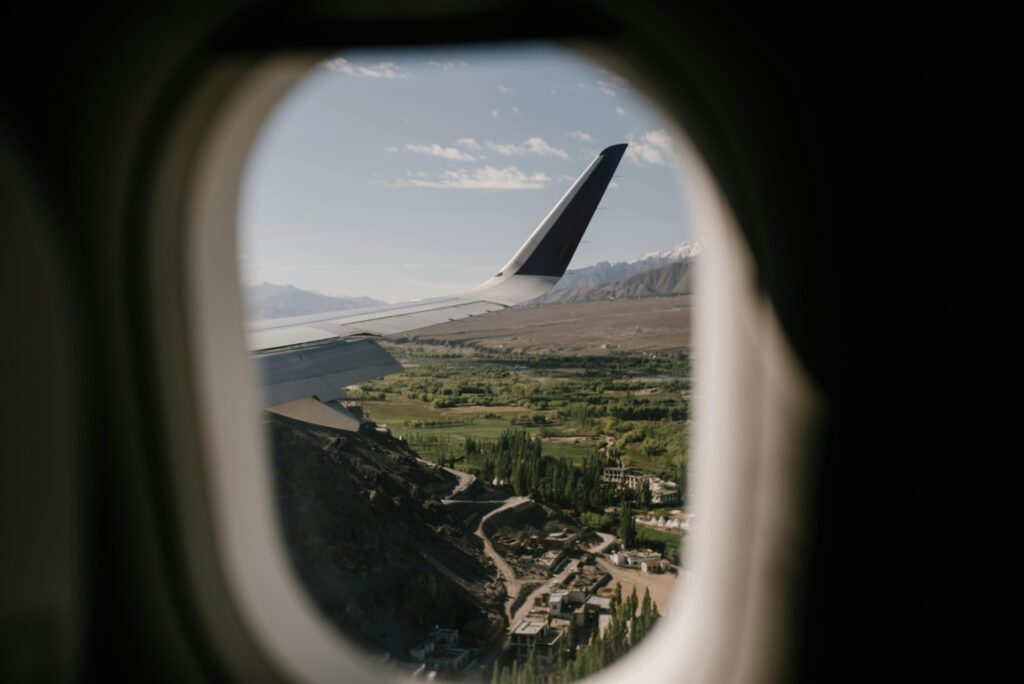 Picture of a landscape outside of a plane window