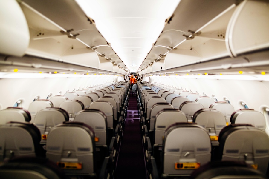 Image looking up the aisle of an empty plane