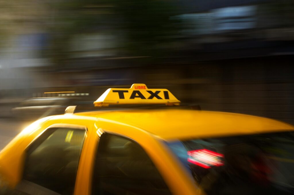 Picture of a yellow taxi cab sign