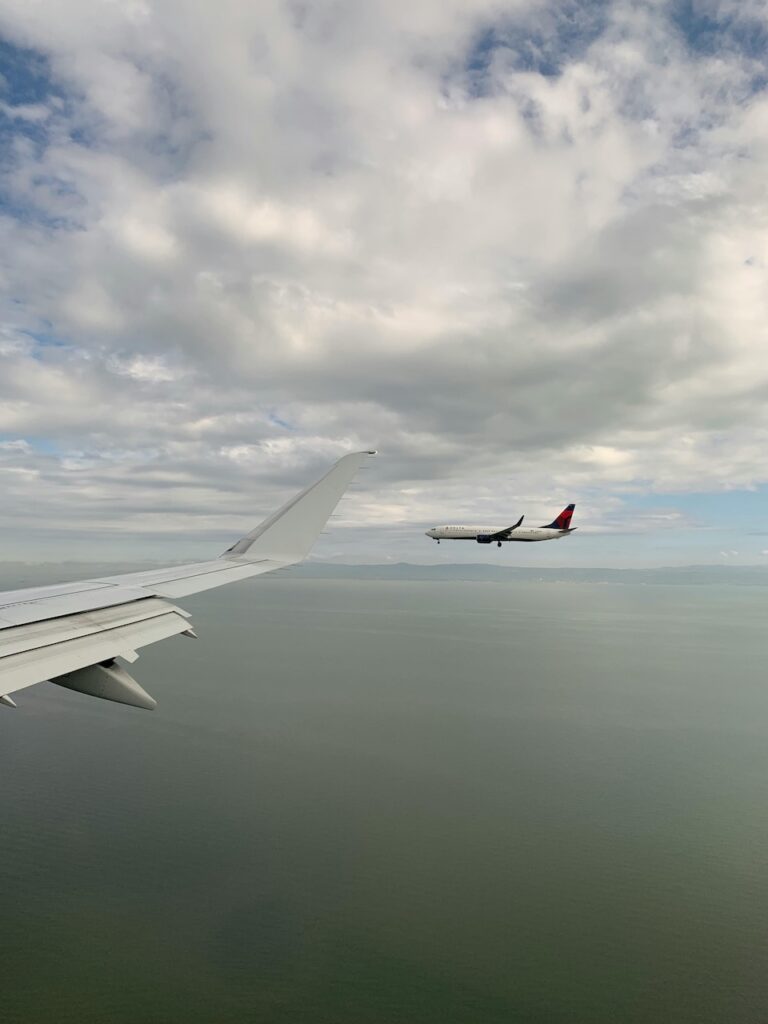 Picture of another plane flying out of a plane window