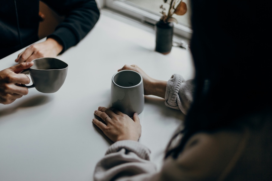 Two people having a coffee and a chat