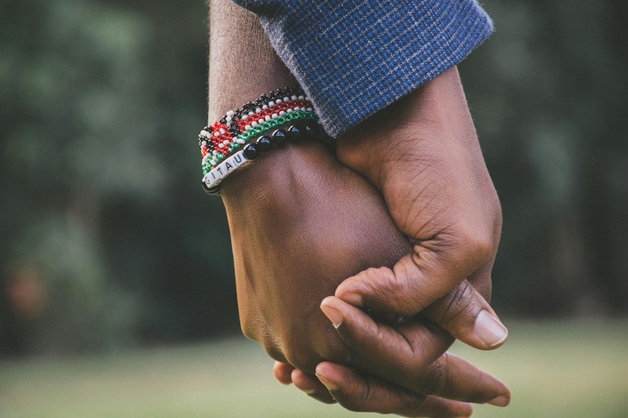 Picture of two people holding hands