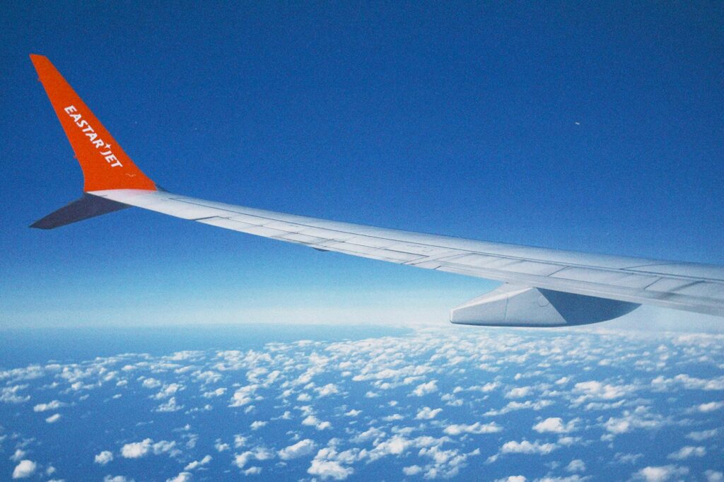 Image of a plane wing bending up slightly while under pressure