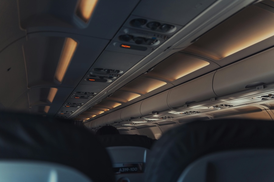 Image inside a plane cabin of dimmed lights