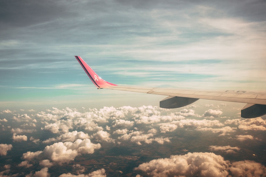 Image of a plane wing from the inside window
