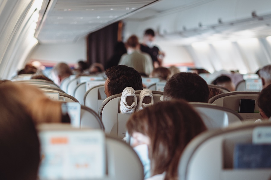 Image inside a busy plane cabin during flight