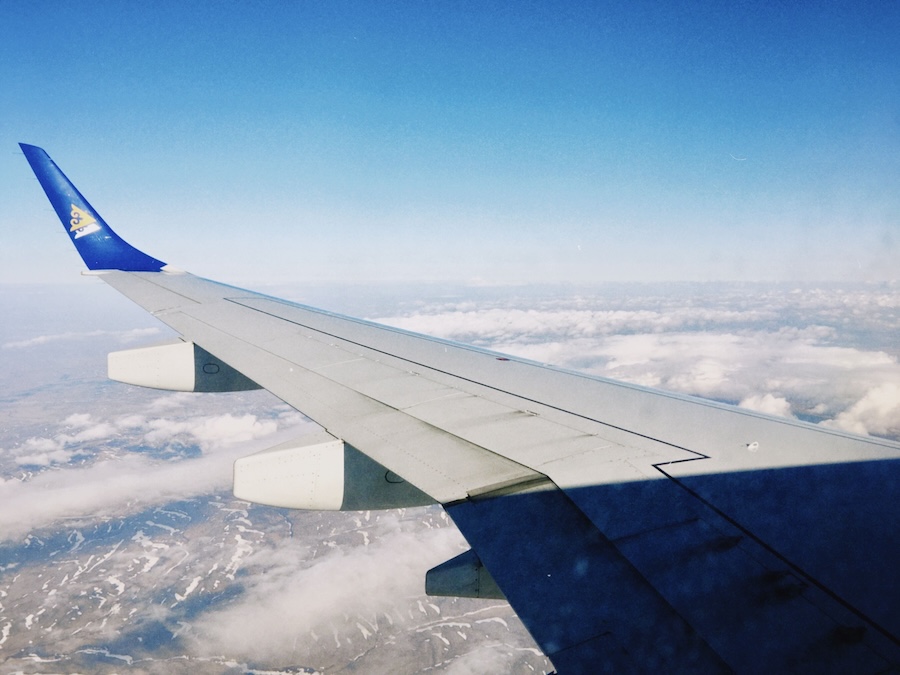 Image of a plane wing at altitude