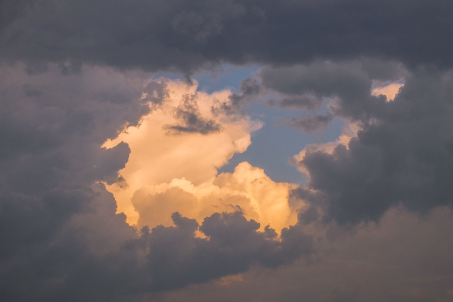 Picture of the sun shining through the clouds