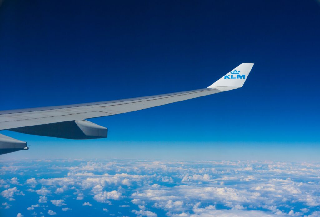 Airplane wing on a crystal clear blue sky