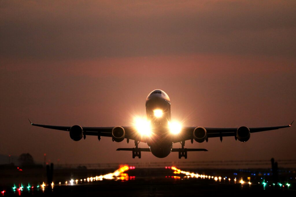 Plane taking off into dark skies